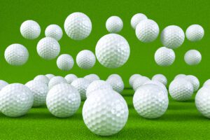 Golf ball on green ground,big tournament 2020 background with copy space for text or winner score board. Concept image for outdoor sport, competition or recreation, 3D rendering.